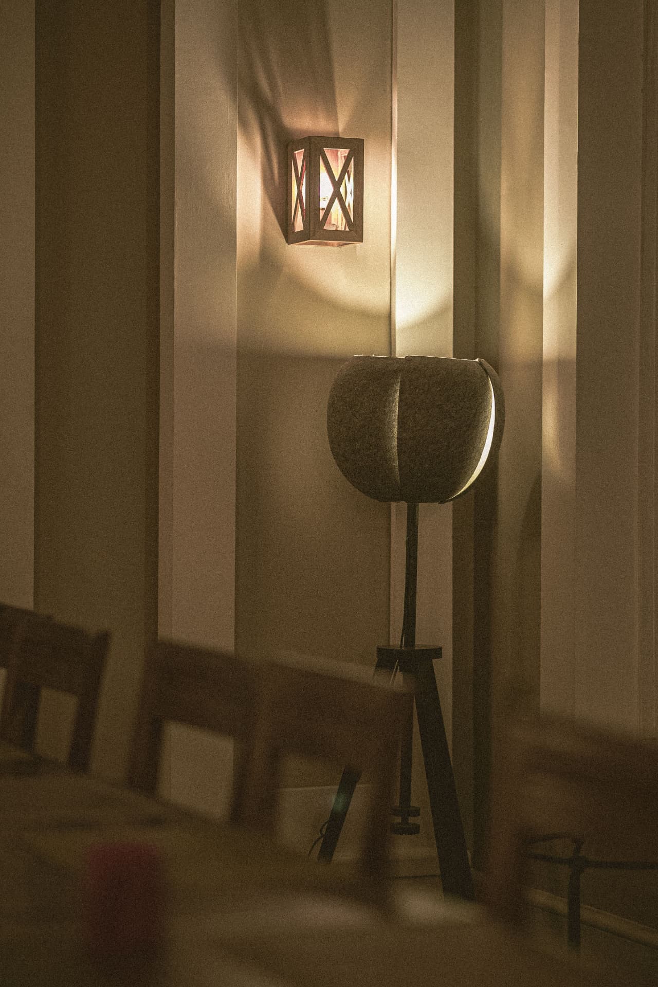 Sculptural lighting installation in a dark, atmospheric luxury interior